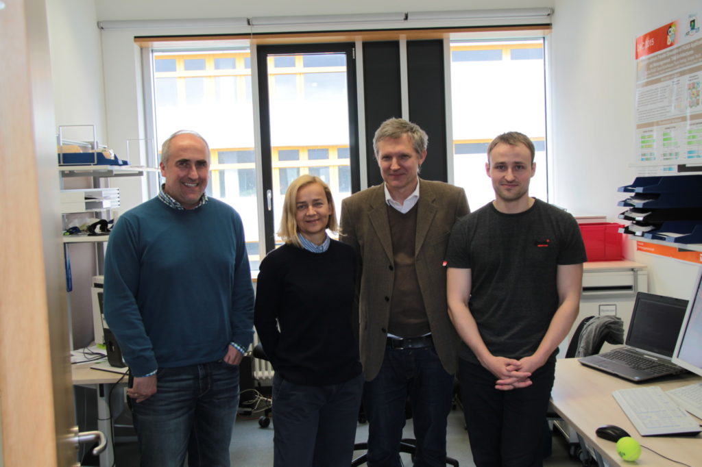 Four persons standing in an office of the HSCD Chair: from the left: Dr. Hannig, Prof. Sciuto, Prof. Teich, S. Roloff