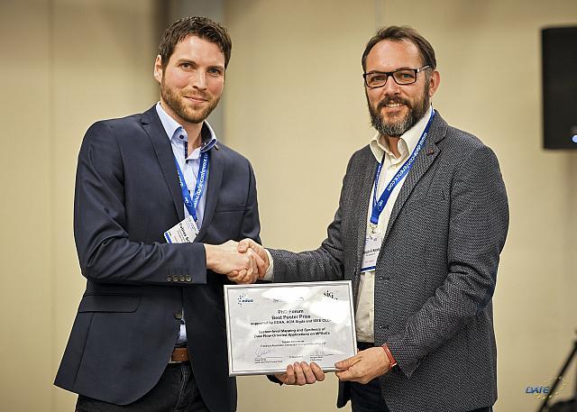 T. Schwarzer (left) proudly receiving his award