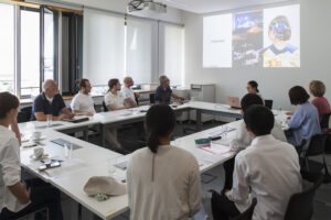 a group of people in a seminar room