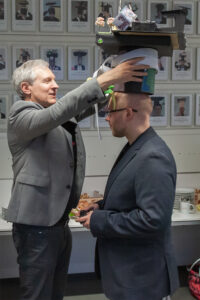 Marcel Brand receives his doctoral hat from Prof. Teich