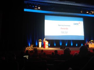 A man is speaking on a podium.
