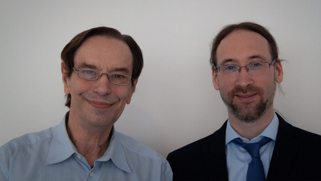 Two smiling men