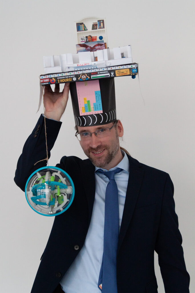 A man with a doctoral hat on