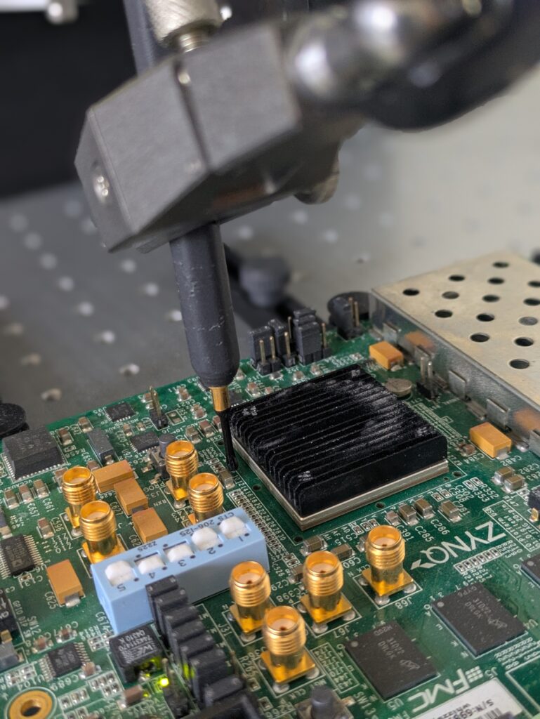 the picture show a part of a FPGA-Board with connectors and a probe beside the FPGA.